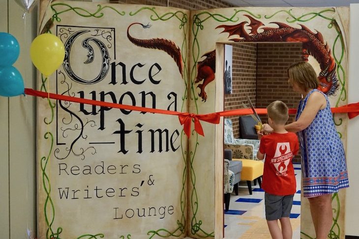 <p>At the ribbon-cutting ceremony, HCS kindergarten student Jack Williams officially opened the space. Jack’s parents, Matt and Lindsey Williams of MW Specialties, built the giant wooden book entryway!</p>
