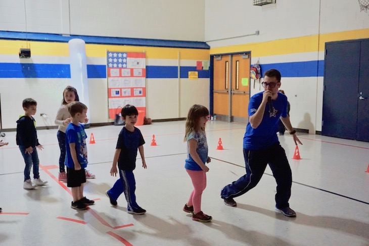 <p>During the Glow Run, Boosterthon team members have grade-level appropriate games for students. A game of freeze, led by “Dan the Man,” kept kindergarten students on their toes.</p>
