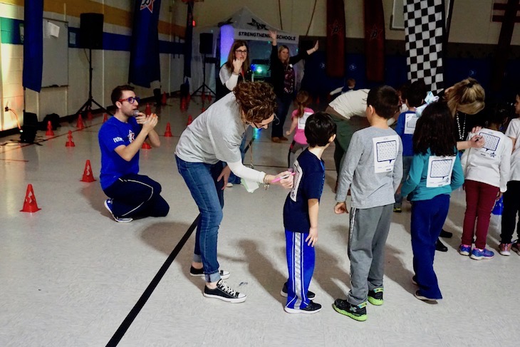 <p>As students completed laps, HCS teachers and volunteers checked off the mileage.</p>
